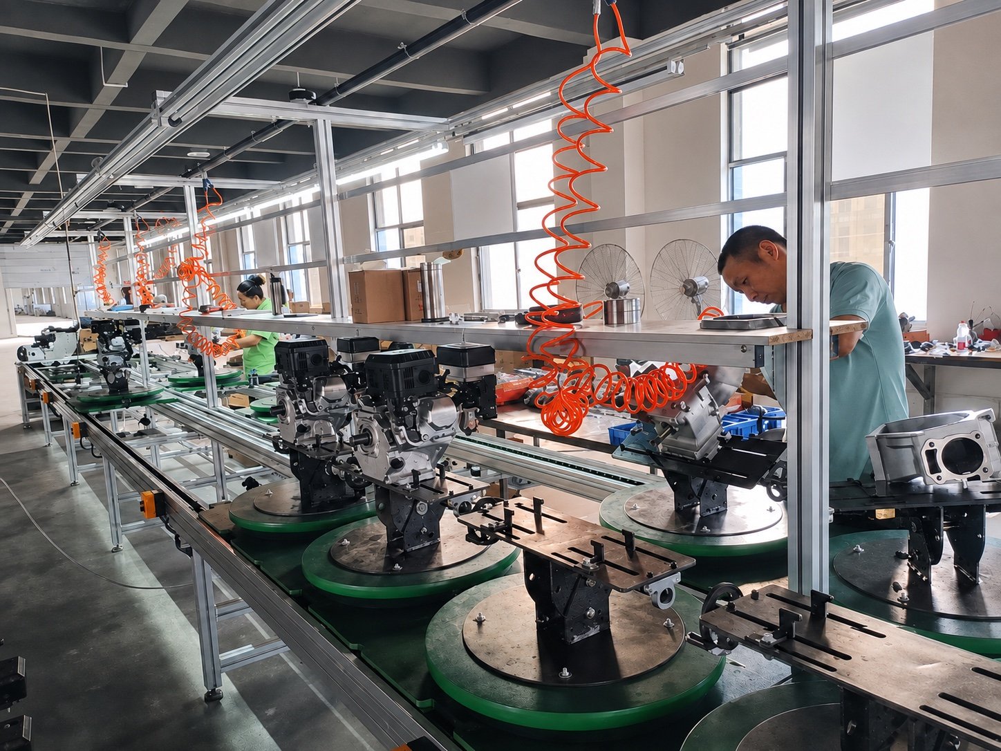 Workers assembling agricultural engines on the production line